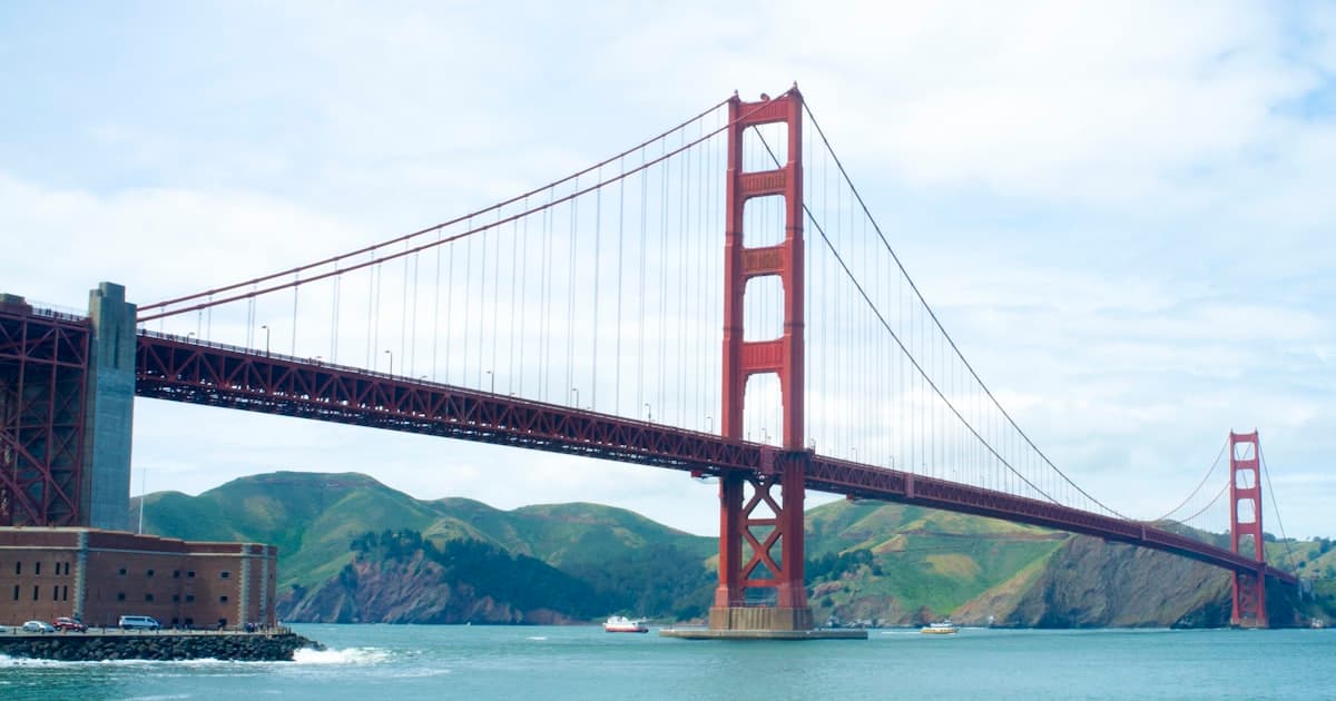 Data comparison chart showing California vs New York across GDP, population, housing costs, and economic indicators