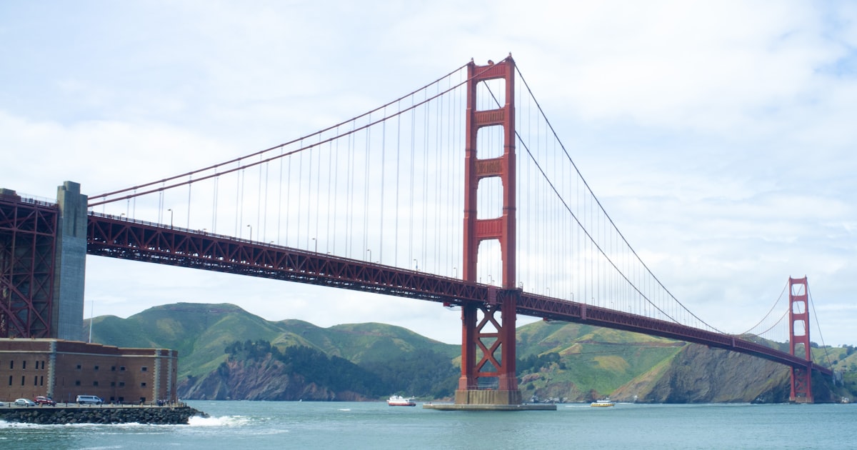 Data comparison chart showing California vs New York across GDP, population, housing costs, and economic indicators