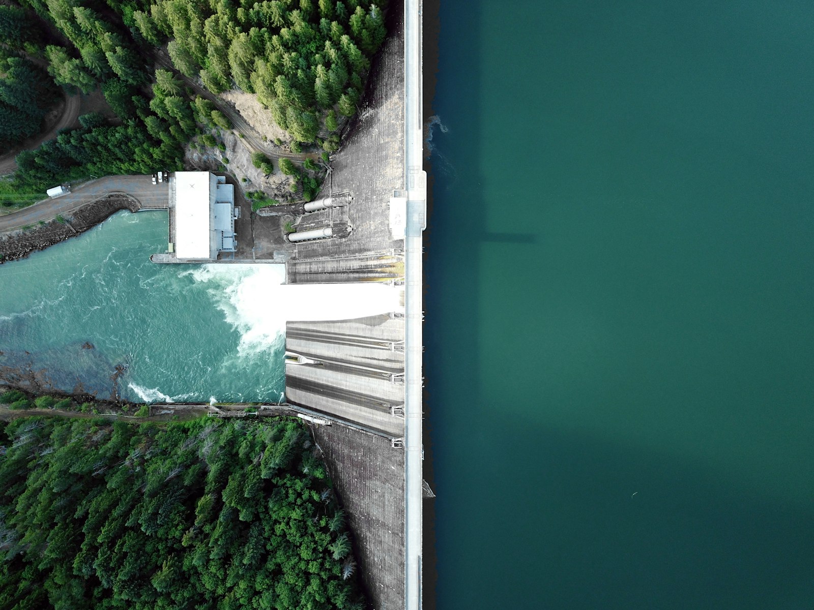 Aerial view of a massive hydroelectric dam representing the largest power plants in the world